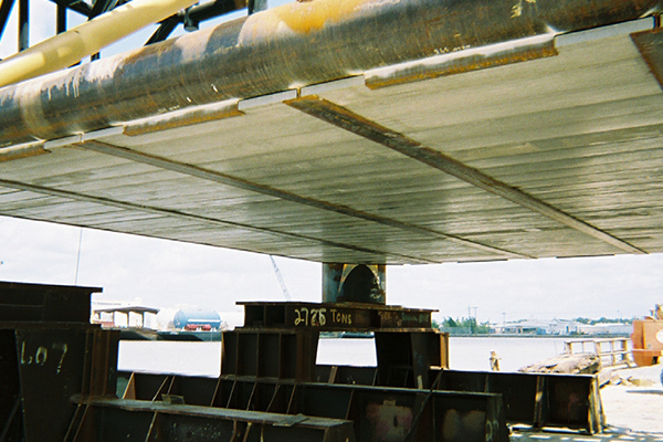 Closeup of AIMS FRP Mudmats installed on an oilfield platform support