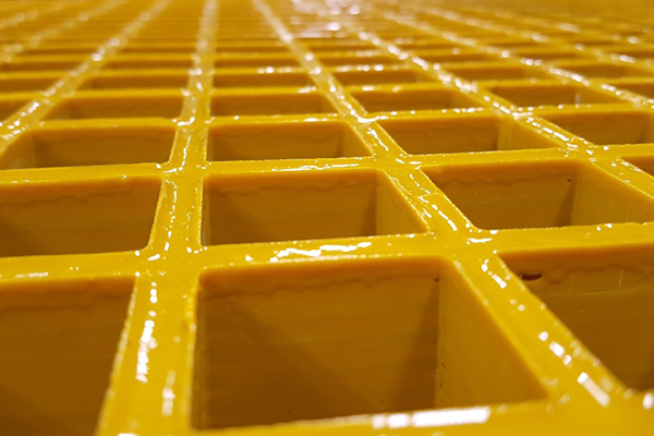 Closeup Detail of Molded Yellow FRP Square Mesh Grating