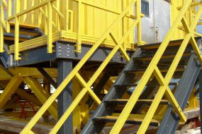 Custom fiberglass structure with handrails, fiberglass grating, I-beams & stair solution
