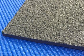 Dark gray fiberglass plate grating on blue matting