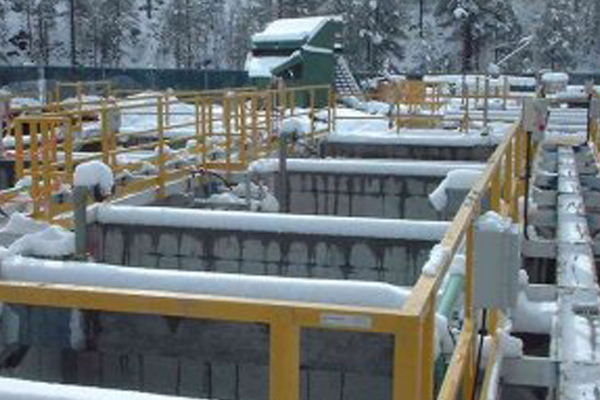 Yellow DeltaRail fiberglass handrail system covered in Snow