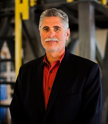 Headshot of AIMS CEO Kinton Lawler at the facility